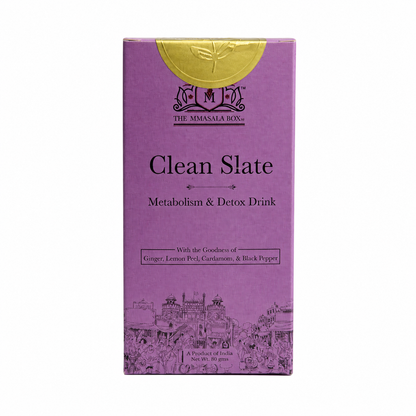 Premium Clean Slate metabolism and detox herbal drink packaging displayed beside a steaming glass cup of golden herbal tea on a wooden table, surrounded by ginger, lemon peel, cardamom, black pepper, and green natural background.
