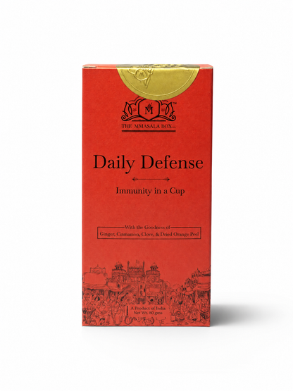 Daily Defense Immunity in a Cup product packaging by The Mmasala Box Co., featuring ginger, cinnamon, clove and dried orange peel wellness drink blend.