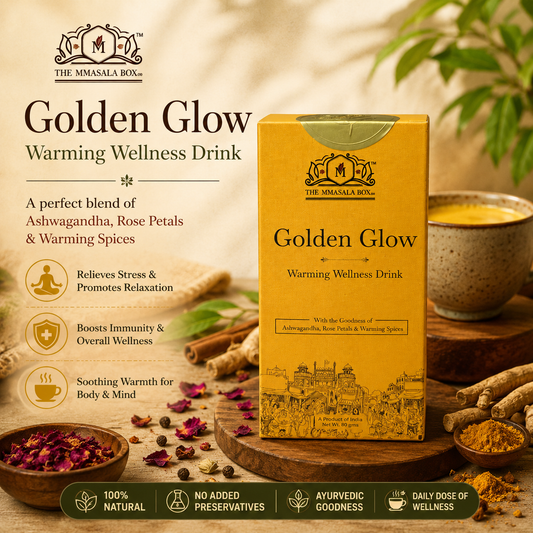 Golden Glow Warming Wellness Drink by The Mmasala Box Co. displayed with rose petals, spices, and a warm herbal drink, highlighting Ayurvedic wellness, relaxation, immunity support, and natural ingredients.