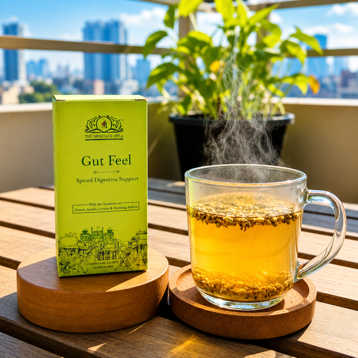 Gut Feel Spiced Digestive Support herbal tea box with steaming detox tea in a glass cup on a wooden table in natural sunlight.