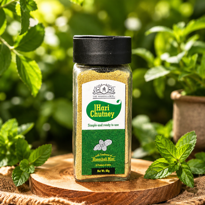 Hari Chutney Powder with Himachali Mint by The MMasala Box Co displayed with fresh mint leaves in a natural outdoor setting