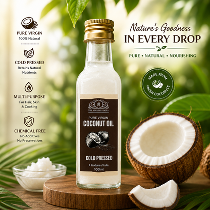 Pure Virgin Coconut Oil by The Mmasala Box Co. displayed with fresh coconuts and tropical leaves, highlighting cold pressed, chemical-free, multi-purpose natural oil for hair, skin, and cooking.