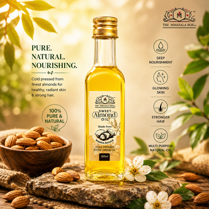 Back side of Cold Pressed Sweet Almond Oil bottle by The MMasala Box Co with product details displayed in a warm natural almond-themed background